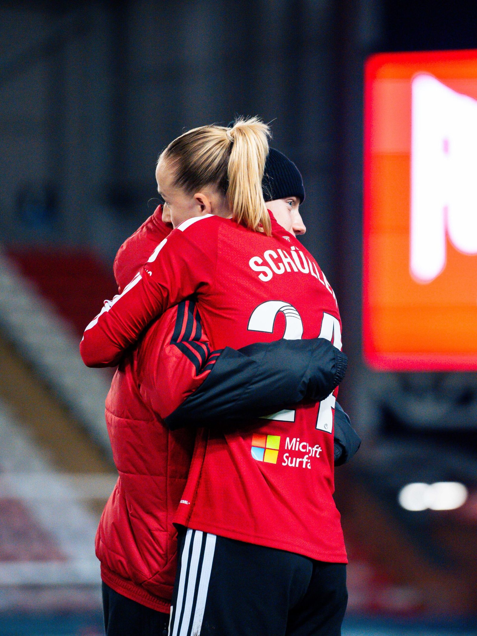 Manchester United Women players embrace after the Burnley match